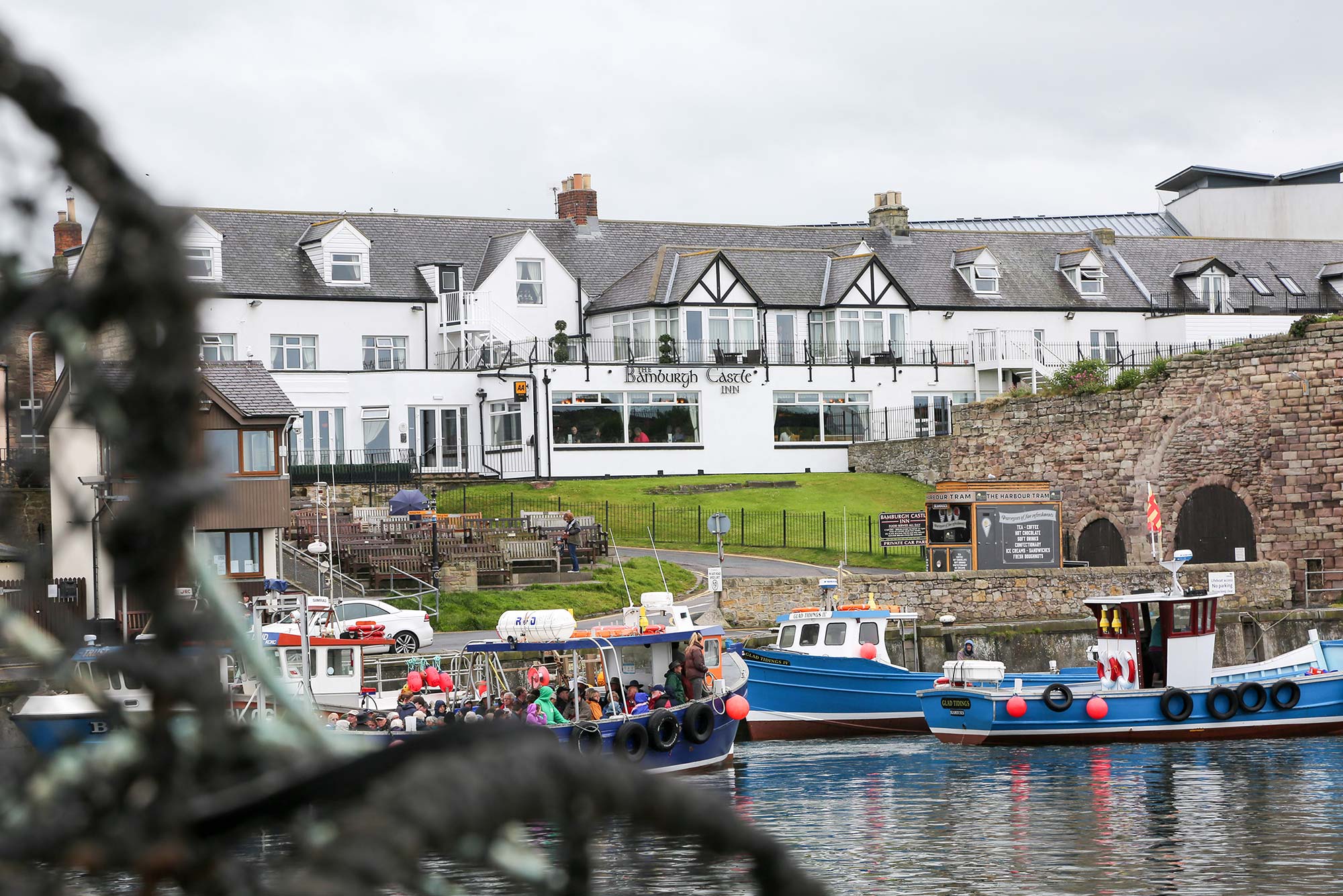 exterior view over the harbour of the Bamburgh Castle Inn, Seahouses